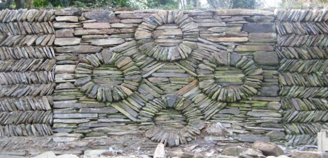 Stonewall built from slate incorporating one of many patterns